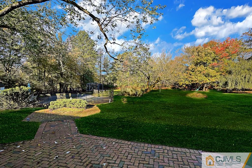 1081 Raritan Road Scotch Plains, NJ 07076 - Photo 25 of 27 a view of a backyard with swimming pool