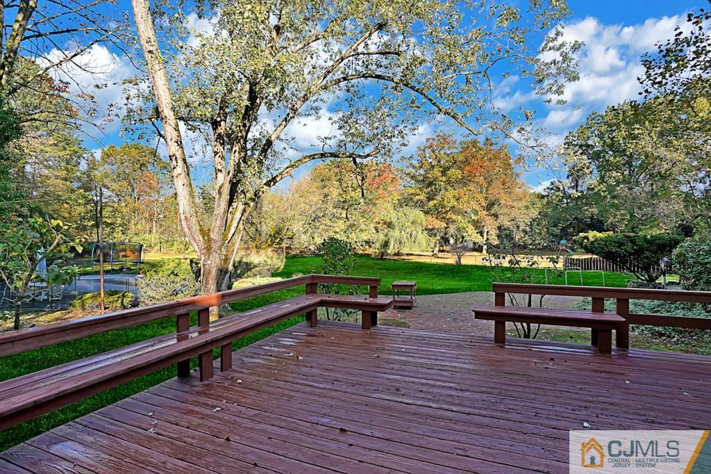 1081 Raritan Road Scotch Plains, NJ 07076 - Photo 26 of 27 a park view with a bench and trees