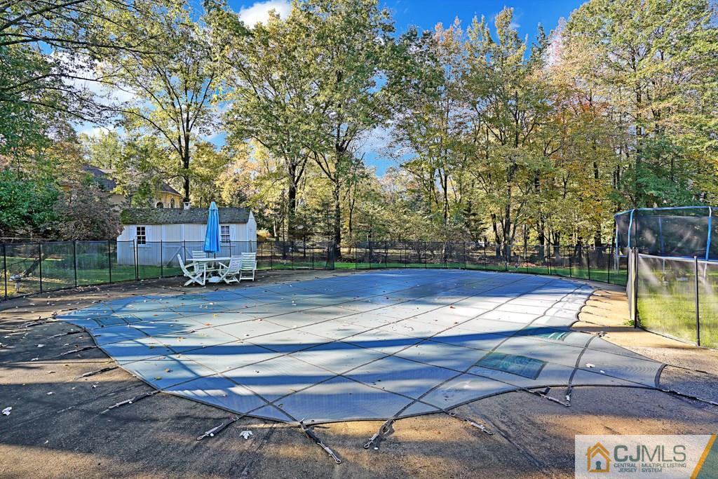 1081 Raritan Road Scotch Plains, NJ 07076 - Photo 27 of 27 a view of a tennis ground with large trees