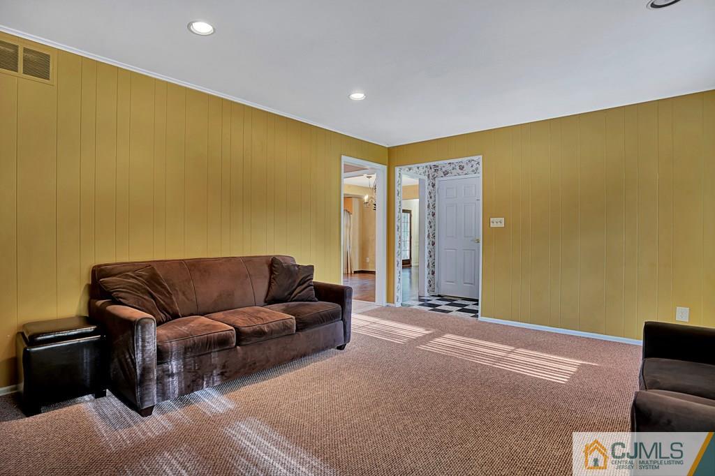 1081 Raritan Road Scotch Plains, NJ 07076 - Photo 6 of 27 a living room with furniture and a couch
