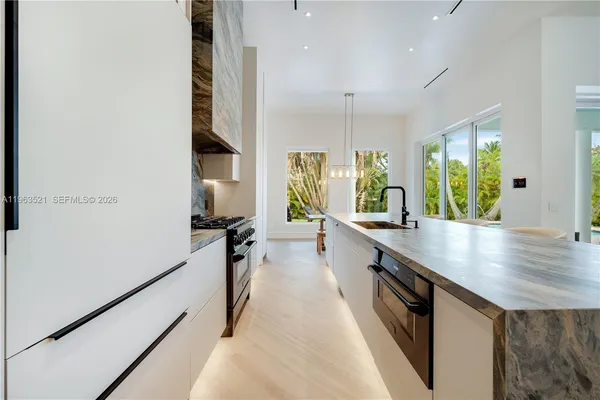 a kitchen with a stove and a sink