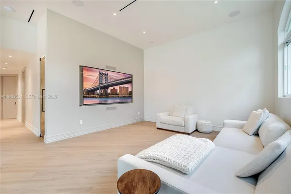 a bed room with a bed and a television