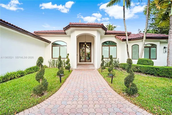 a living room with furniture window and wooden floor