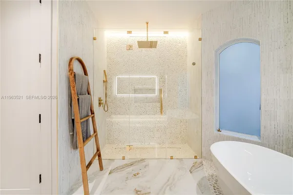 a en suite bathroom with a sink a toilet and a shower