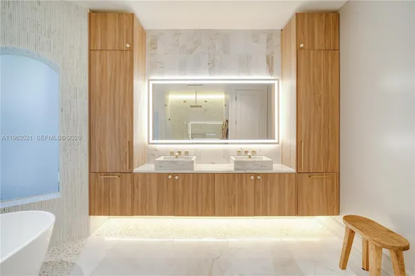 a bathroom with a granite countertop sink a toilet and shower