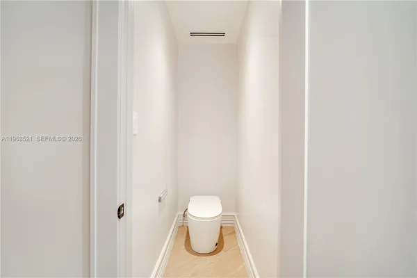 a kitchen with granite countertop a sink and a stove