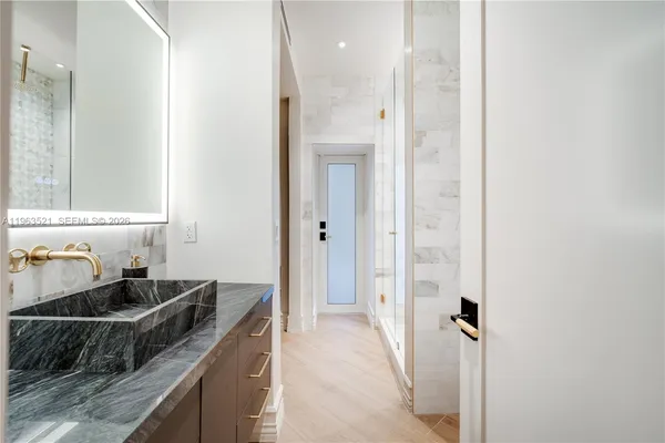 a view of a lake with houses in the back