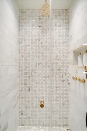 a front view of house with yard and trees around