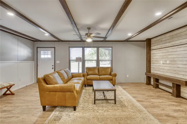a kitchen with a sink and large wooden cabinets