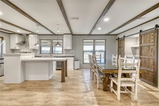 a spacious bedroom with a bed and a window