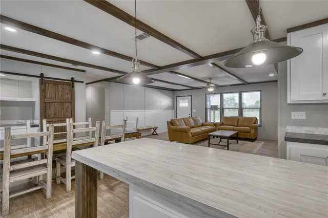 a bathroom with a glass shower door and mirror