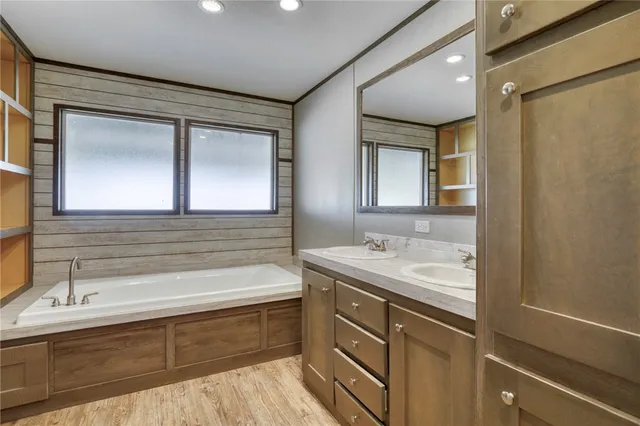 a view of a swimming pool with a bench and lake view