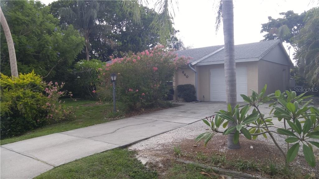 640 Clematis Road Venice, FL 34293 - Photo 1 of 1 a view of a garden with pathway