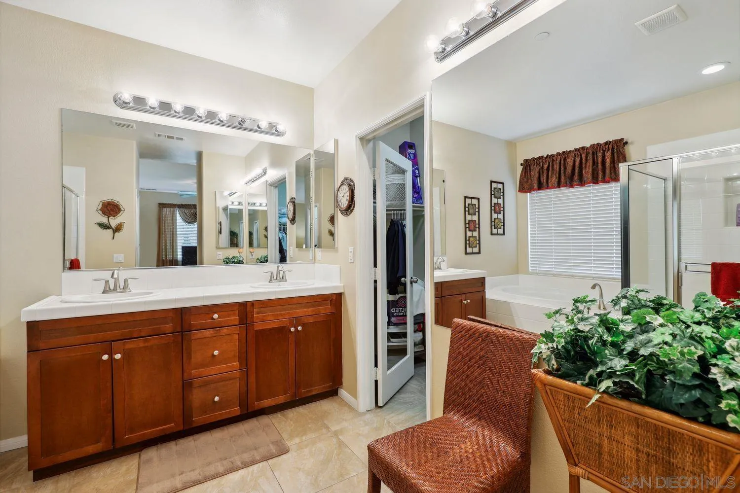 3250 Beven Drive Escondido, CA 92027 - Photo 14 of 34 a spacious bathroom with a double vanity sink and a mirror
