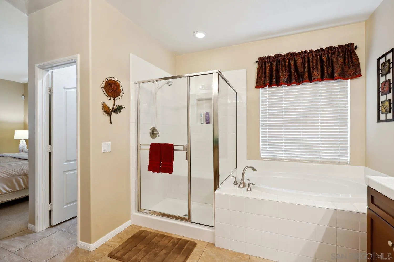 3250 Beven Drive Escondido, CA 92027 - Photo 15 of 34 a bathroom with a bathtub and a shower