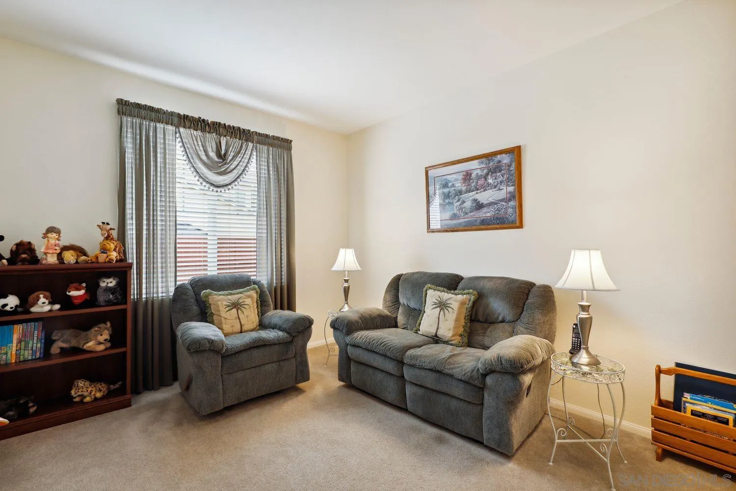 3250 Beven Drive Escondido, CA 92027 - Photo 18 of 34 a living room with furniture and a book shelf