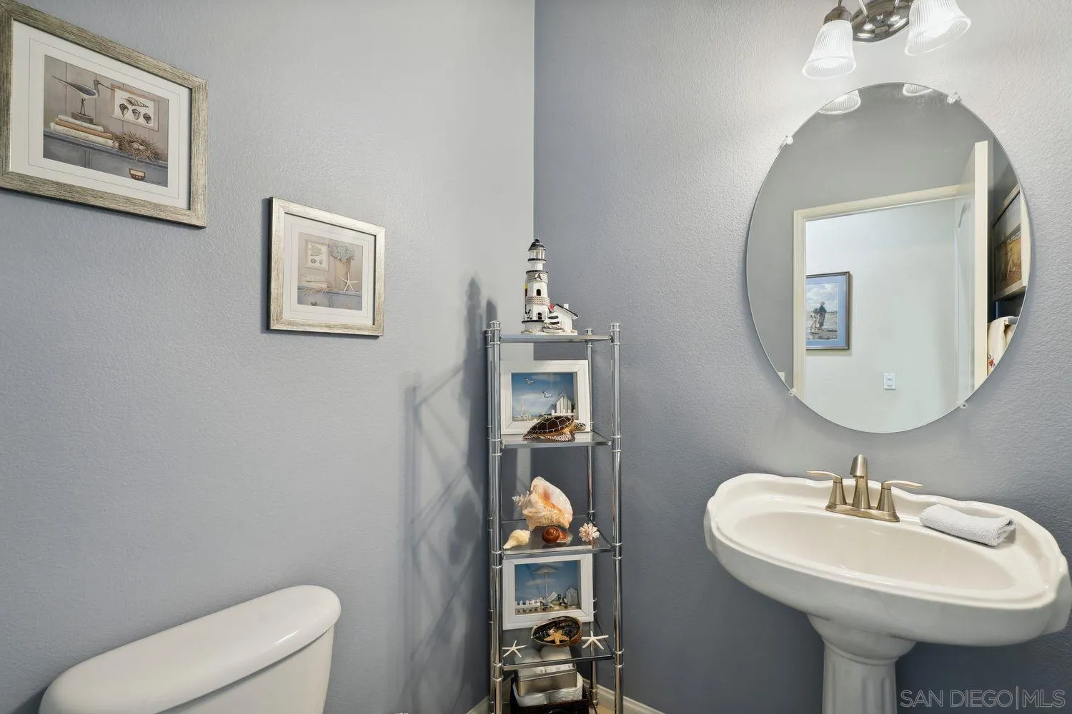 3250 Beven Drive Escondido, CA 92027 - Photo 21 of 34 a bathroom with a toilet sink and mirror
