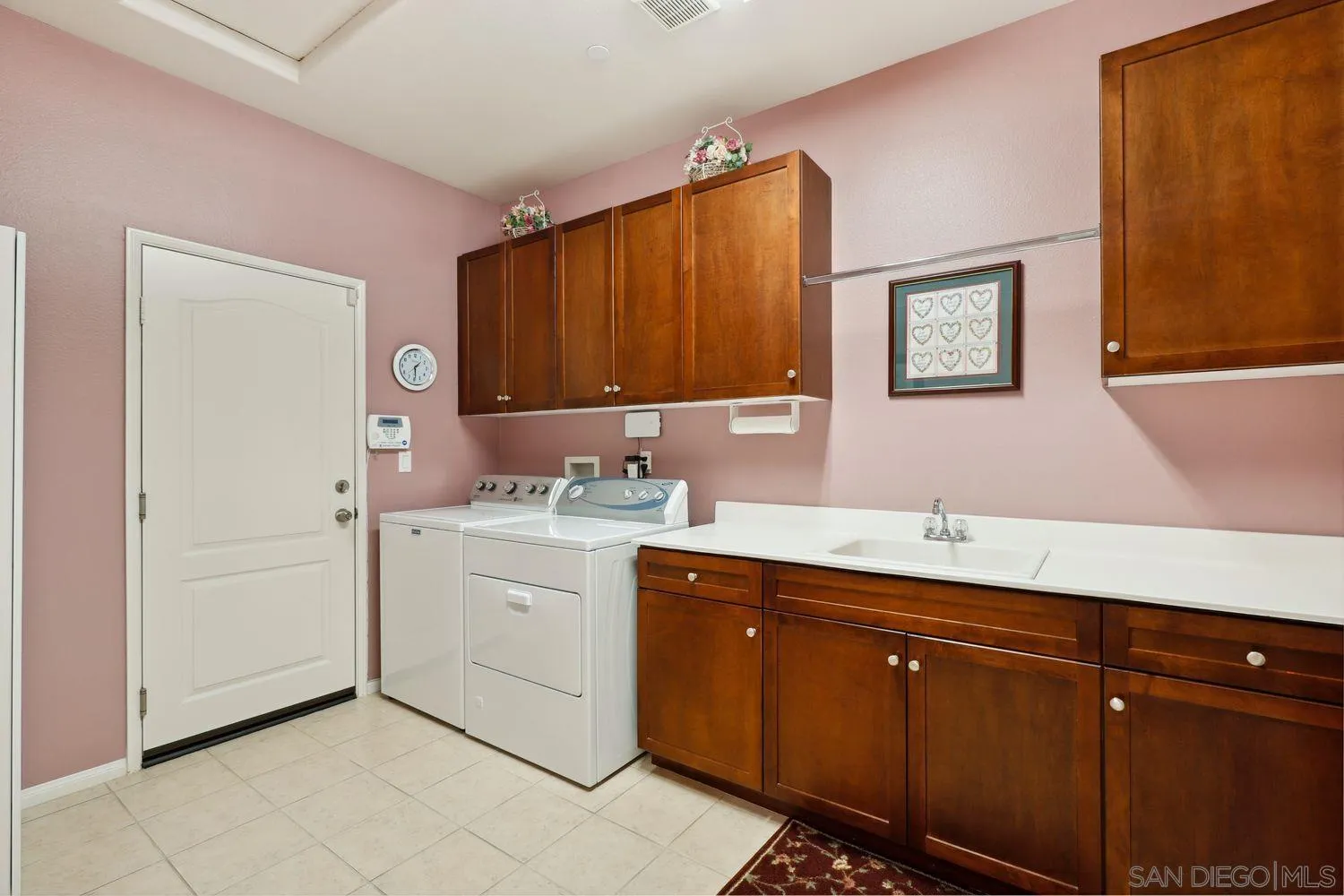 3250 Beven Drive Escondido, CA 92027 - Photo 24 of 34 a bathroom with a sink and a mirror
