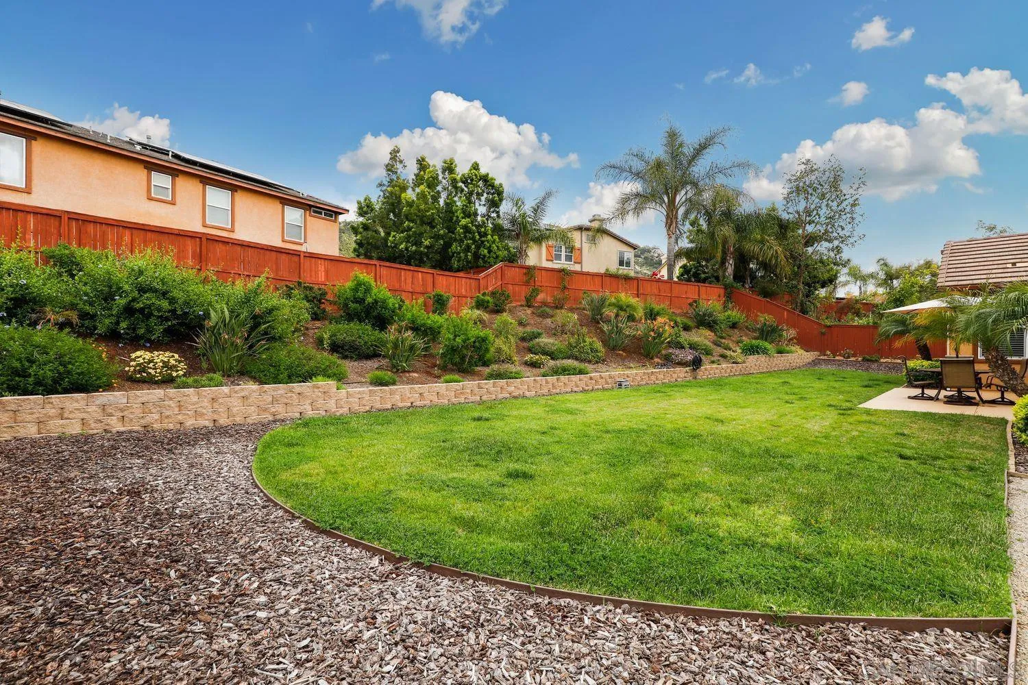 3250 Beven Drive Escondido, CA 92027 - Photo 27 of 34 a view of a garden with a building in the background