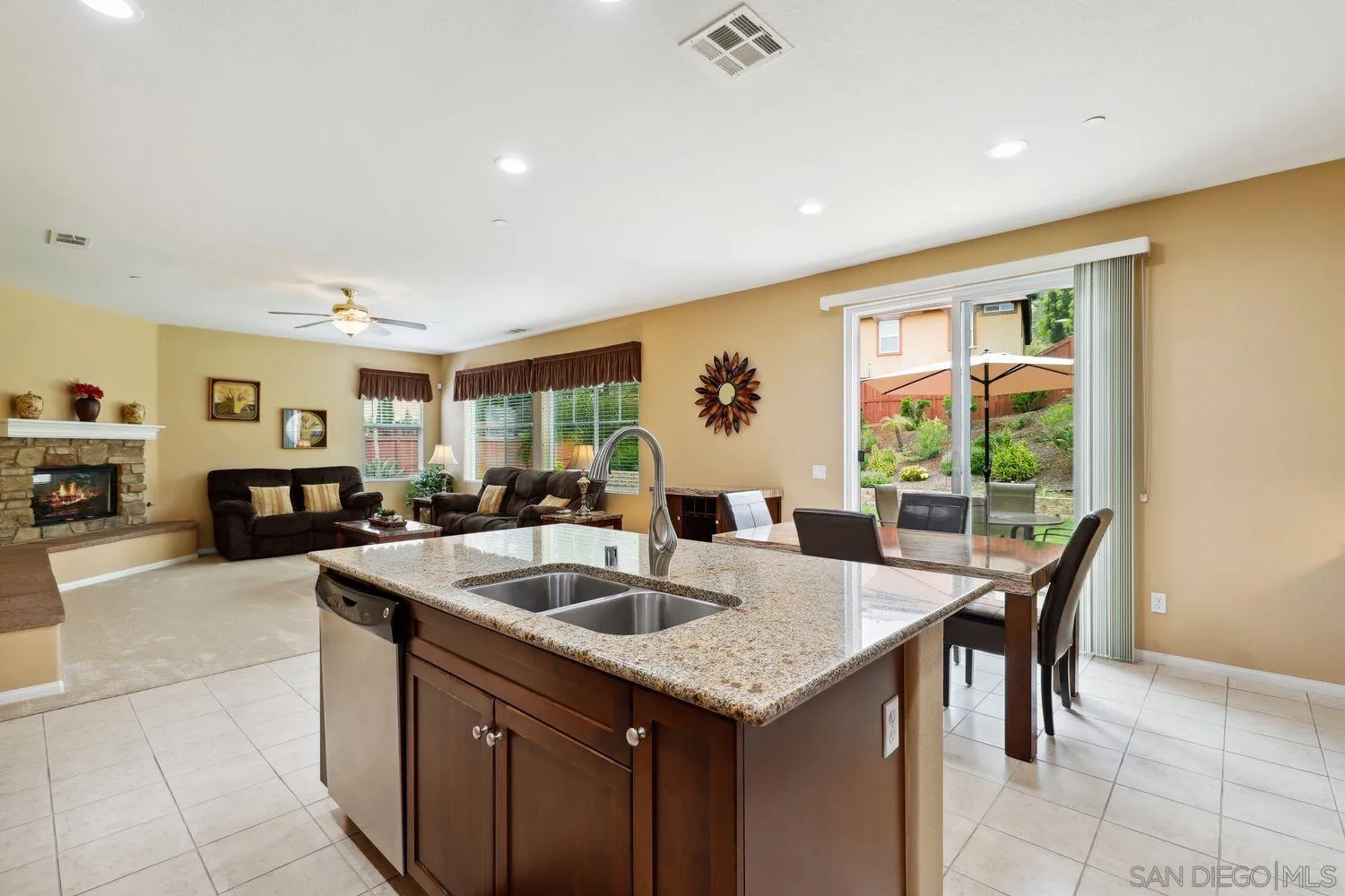 3250 Beven Drive Escondido, CA 92027 - Photo 10 of 34 a kitchen with granite countertop a sink and cabinets