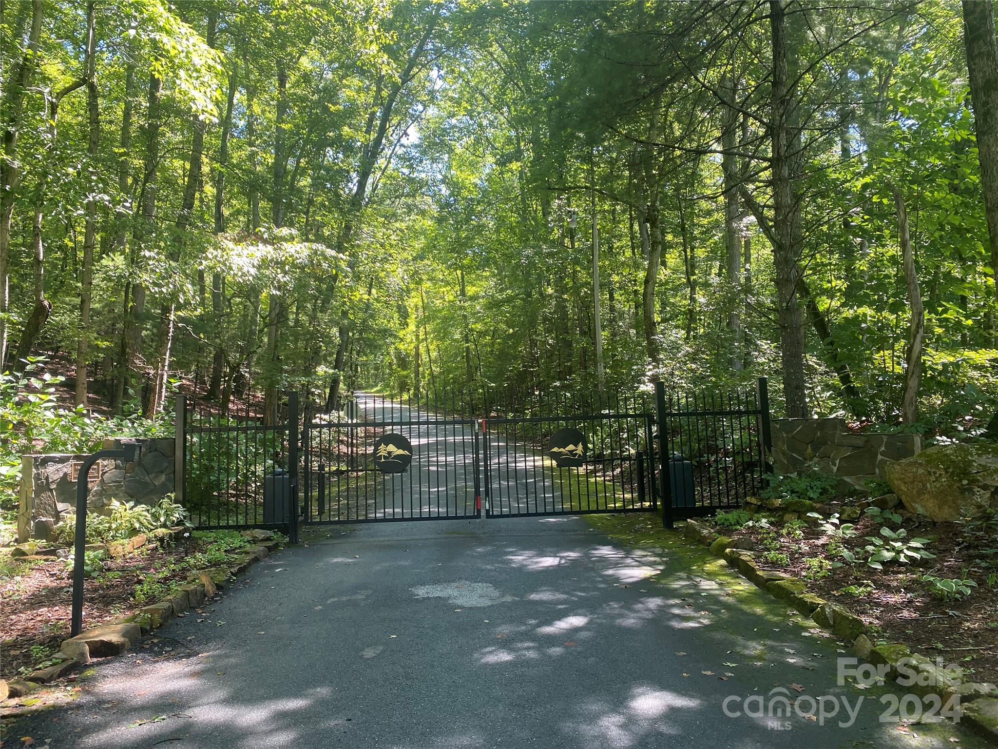 Lot 11 Fox Ridge Trail Marion, NC 28752 - Photo 2 of 12 a view of a forest with trees and buildings