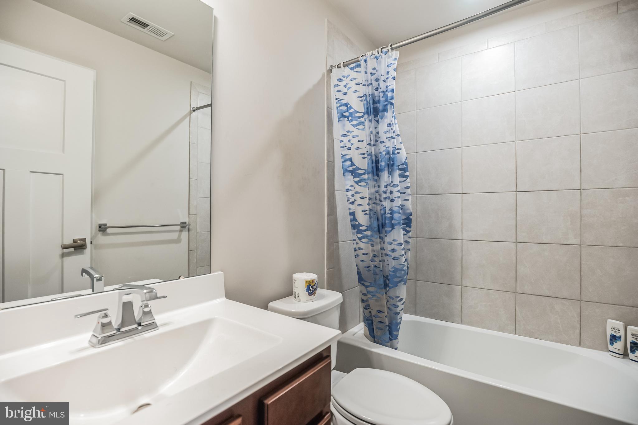 28 Sparrow Circle Sewell, NJ 08080 - Photo 14 of 15 a bathroom with a sink toilet a mirror and shower