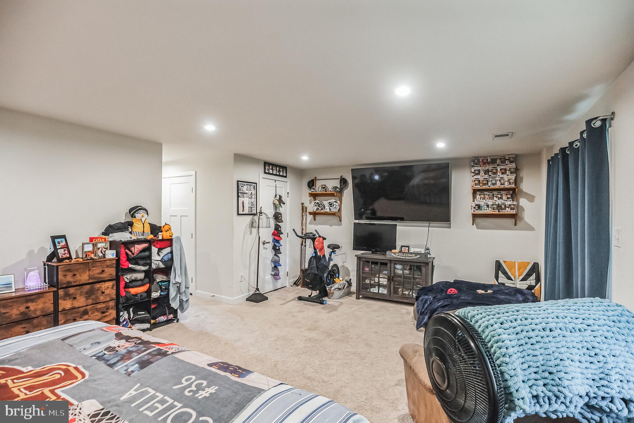 28 Sparrow Circle Sewell, NJ 08080 - Photo 3 of 15 a bed room with a bed and a flat screen tv