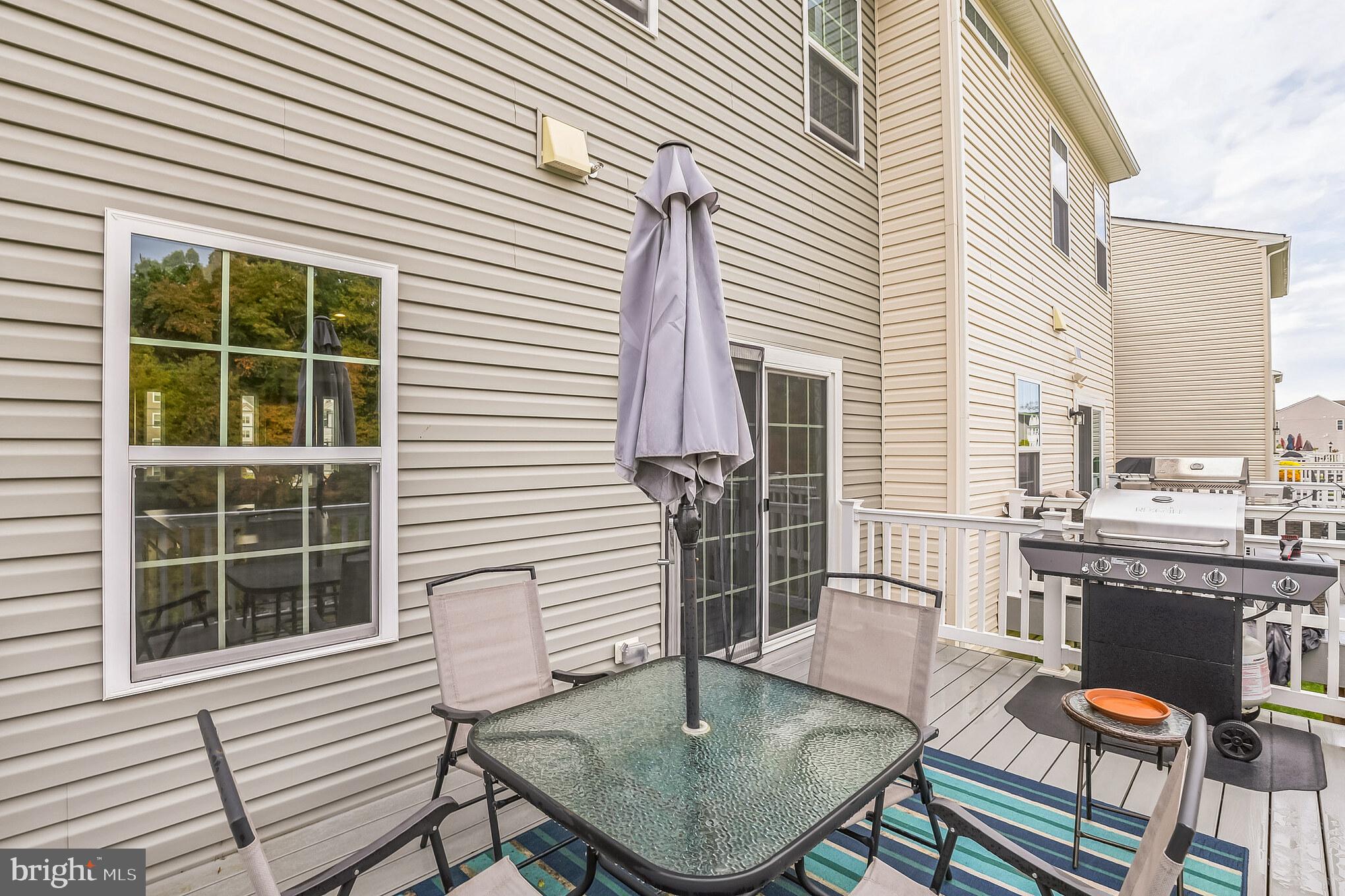 28 Sparrow Circle Sewell, NJ 08080 - Photo 9 of 15 a patio with table and chairs and potted plants
