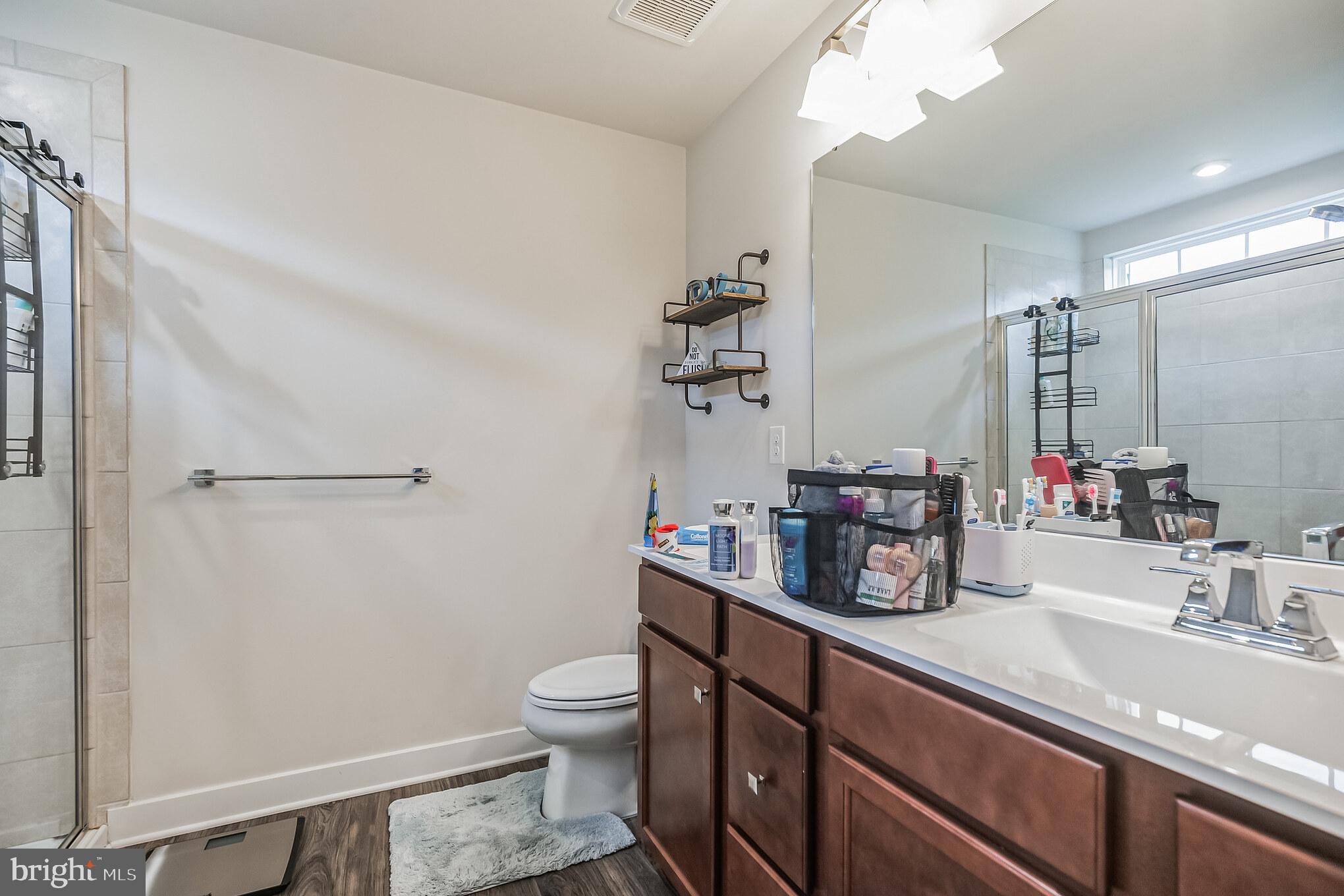 28 Sparrow Circle Sewell, NJ 08080 - Photo 10 of 15 a bathroom with a sink a toilet and shower