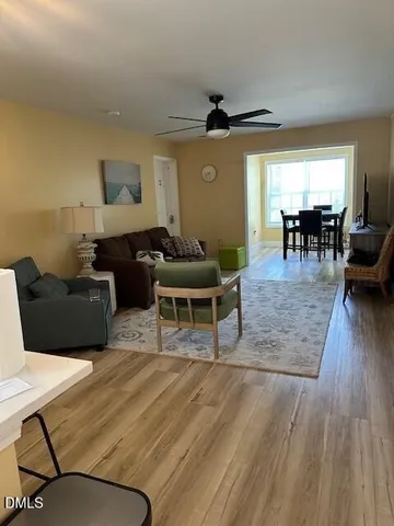 a kitchen with stainless steel appliances granite countertop a sink stove microwave and refrigerator