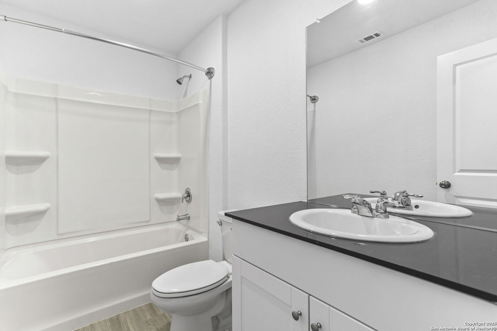 31838 Cherry Bulverde, TX 78163 - Photo 14 of 19 a bathroom with a sink a toilet and a mirror