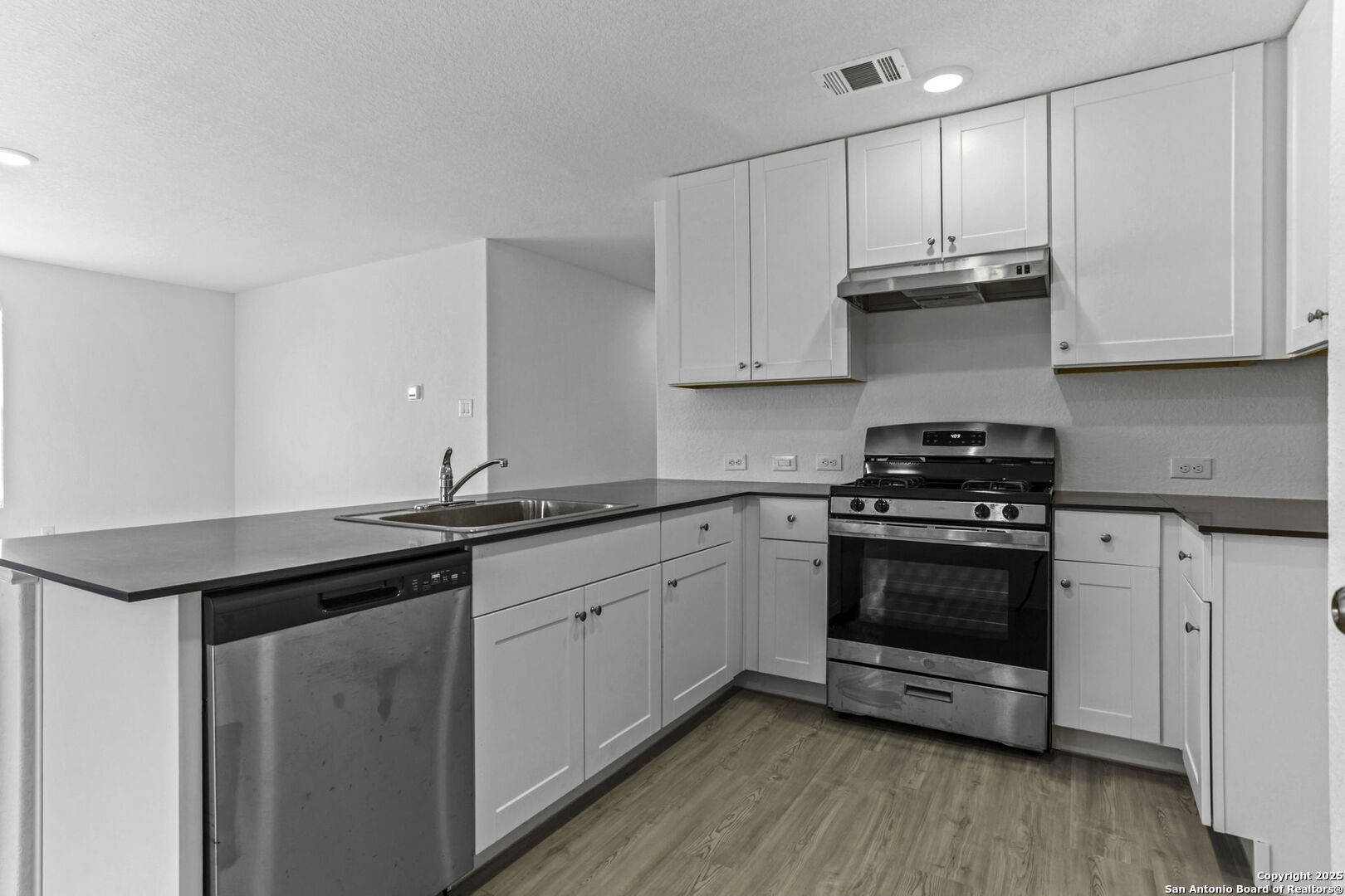 31838 Cherry Bulverde, TX 78163 - Photo 9 of 19 a kitchen with granite countertop a sink and cabinets