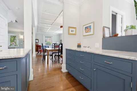 a living room with granite countertop furniture and a dining table