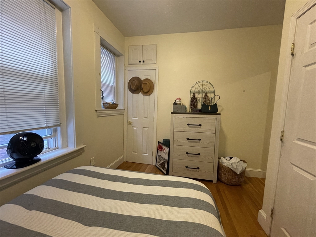 191 Winthrop Road, Unit 2 Brookline, MA 02445 - Photo 13 of 15 a bedroom with a bed and a cabinets