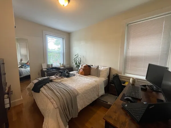a bed room with two bed and a couch