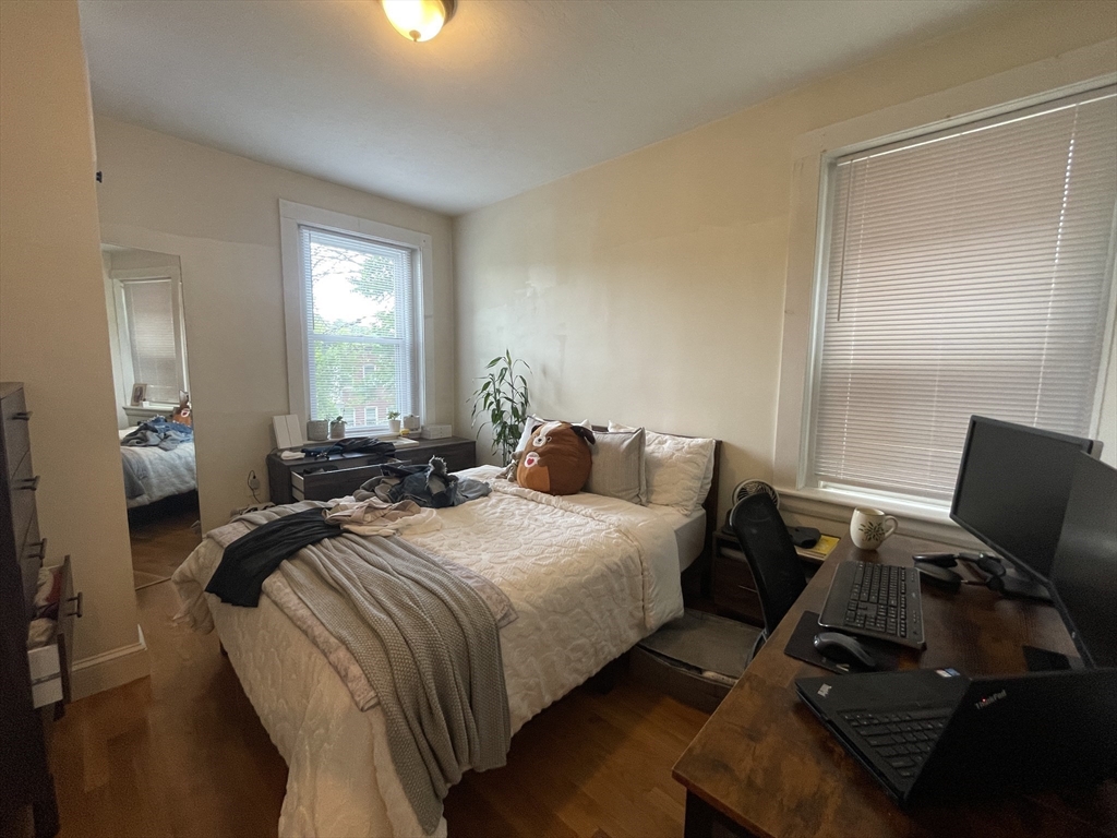 191 Winthrop Road, Unit 2 Brookline, MA 02445 - Photo 14 of 15 a bed room with two bed and a couch