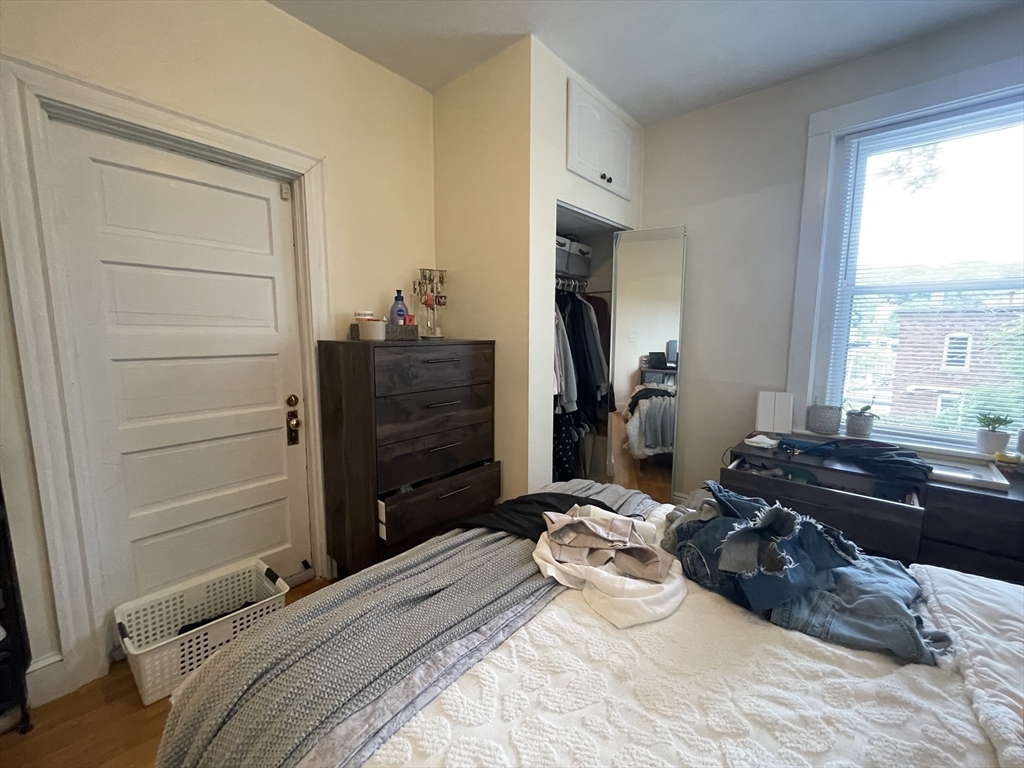 191 Winthrop Road, Unit 2 Brookline, MA 02445 - Photo 15 of 15 a bedroom with a bed and a dresser