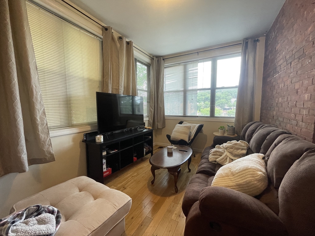 191 Winthrop Road, Unit 2 Brookline, MA 02445 - Photo 10 of 15 a living room with furniture and a flat screen tv