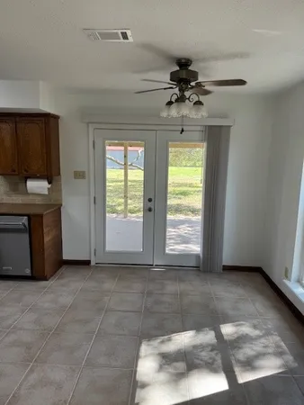a view of a kitchen with a sink and a window