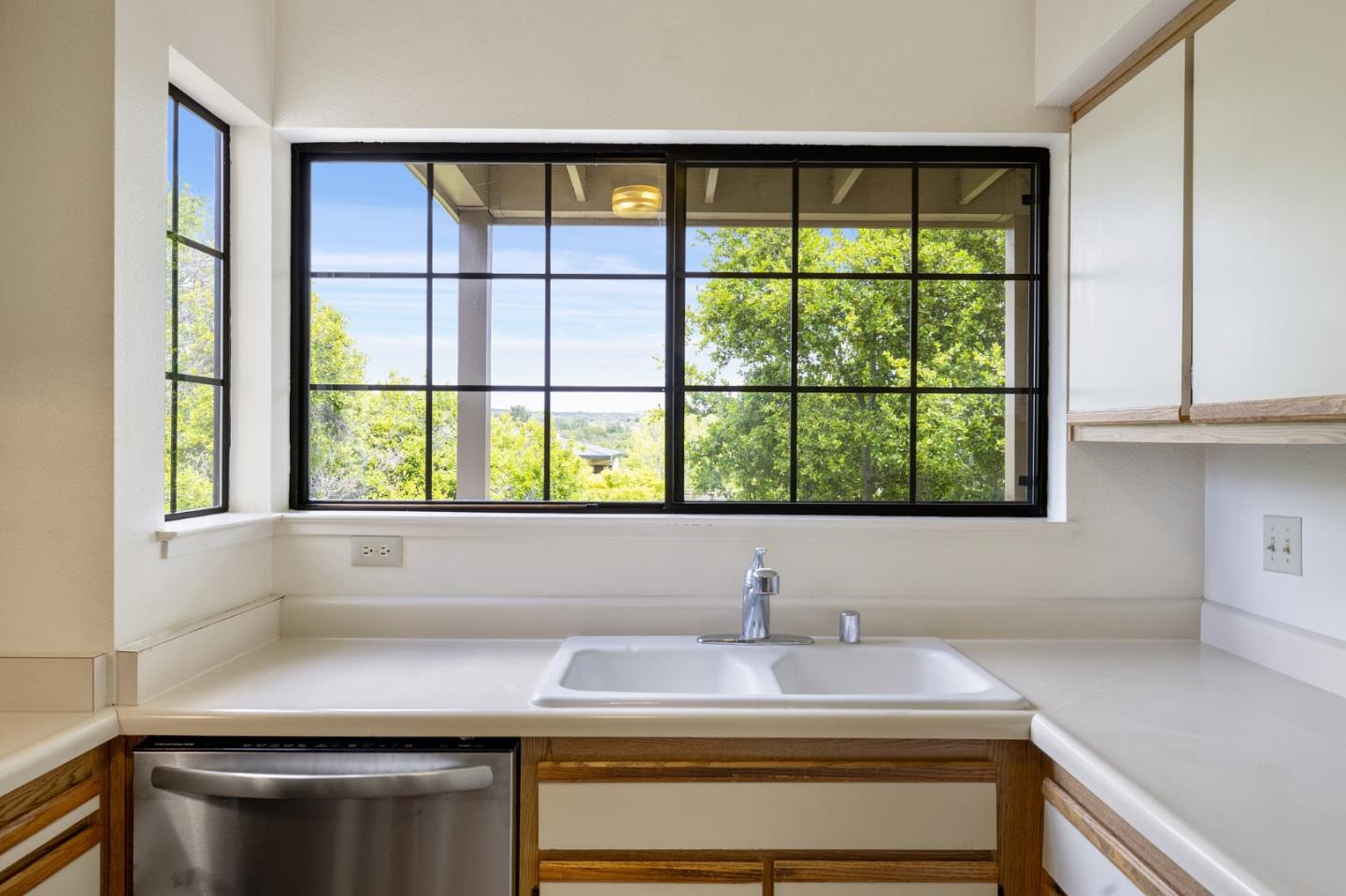 a kitchen with a sink and a window