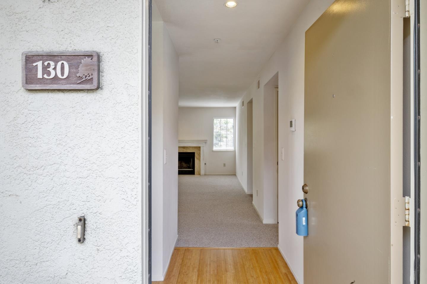 130 Pheasant Ridge Road Del Rey Oaks, CA 93940 - Photo 2 of 23 a view of a hallway with wooden floor and staircase