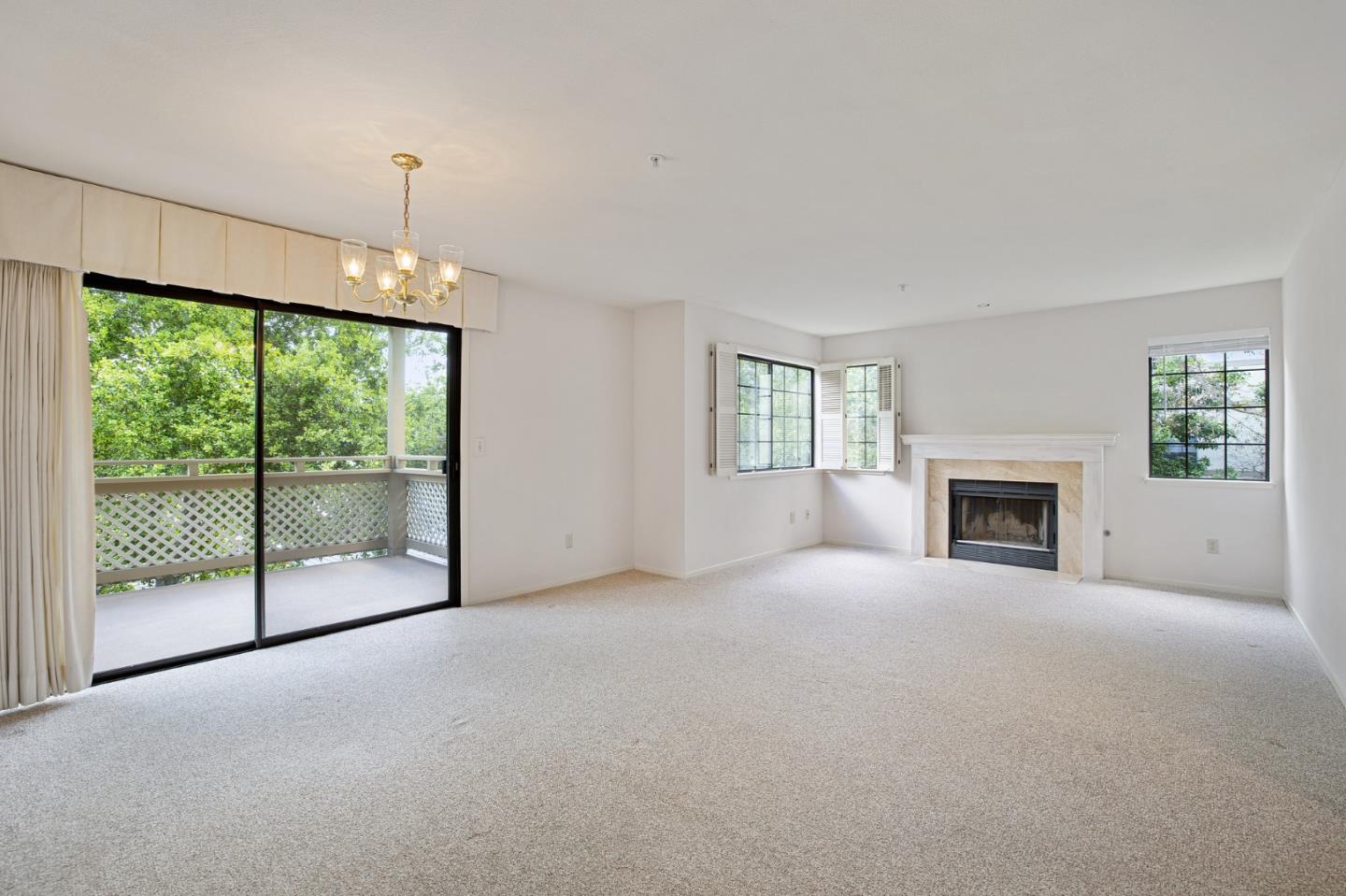 130 Pheasant Ridge Road Del Rey Oaks, CA 93940 - Photo 3 of 23 a view of empty room with floor to ceiling windows and fireplace