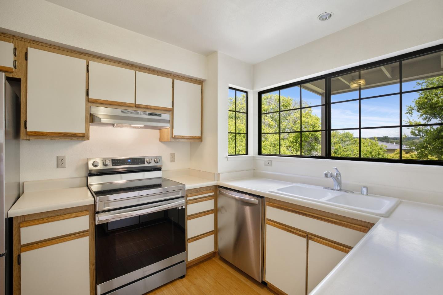 130 Pheasant Ridge Road Del Rey Oaks, CA 93940 - Photo 6 of 23 a kitchen with a sink stove and cabinets
