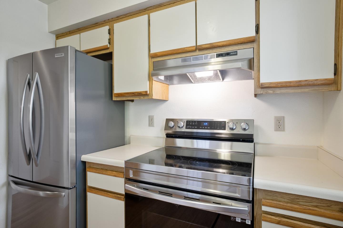 130 Pheasant Ridge Road Del Rey Oaks, CA 93940 - Photo 7 of 23 a kitchen with appliances and a refrigerator