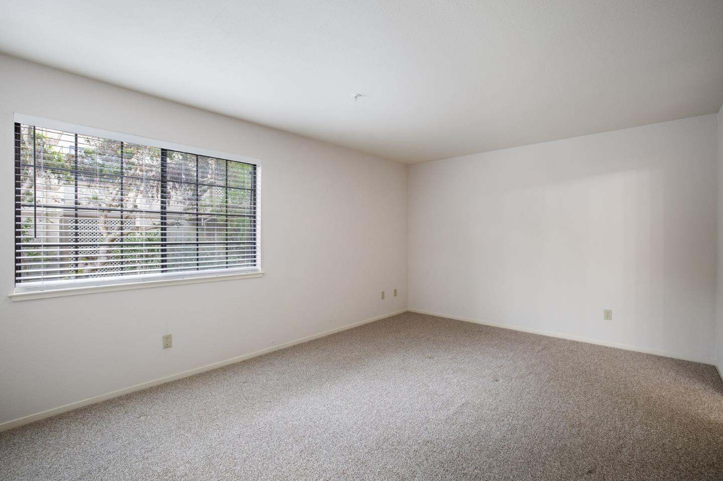 130 Pheasant Ridge Road Del Rey Oaks, CA 93940 - Photo 9 of 23 an empty room with a window