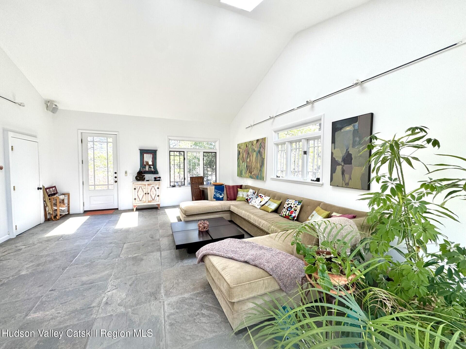 115 Jones Quarry Road Woodstock, NY 12498 - Photo 11 of 38 a living room with furniture and a large window