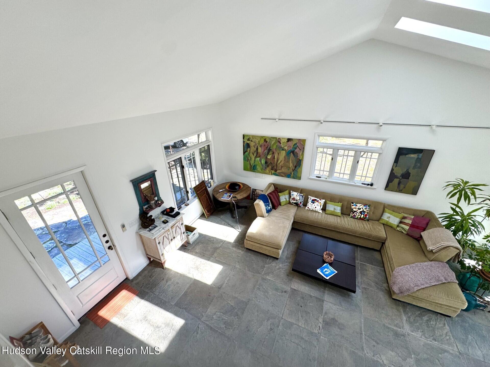 115 Jones Quarry Road Woodstock, NY 12498 - Photo 12 of 38 a living room with furniture and a flat screen tv