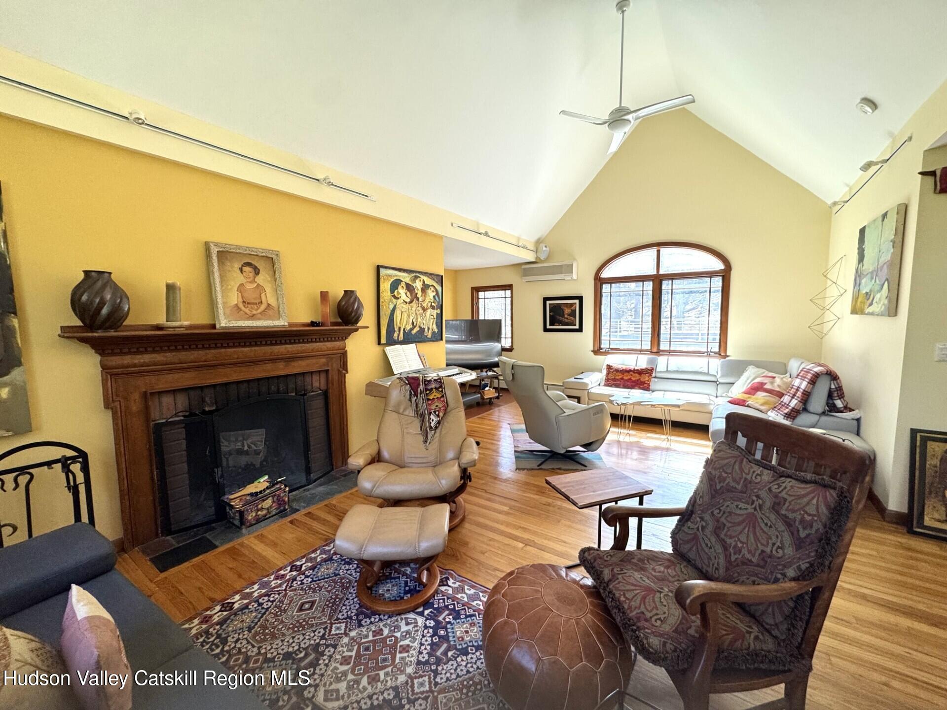 115 Jones Quarry Road Woodstock, NY 12498 - Photo 14 of 38 a living room with furniture a fireplace and wooden floor