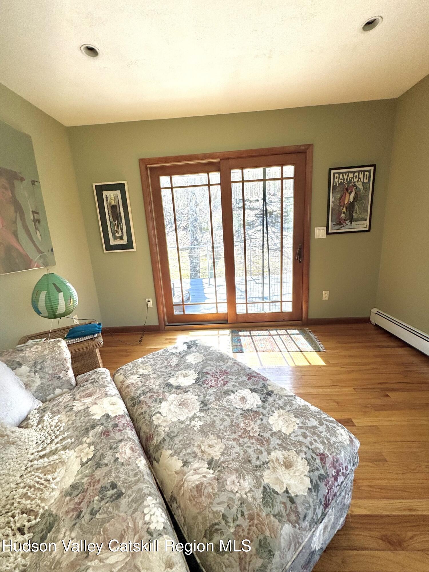 115 Jones Quarry Road Woodstock, NY 12498 - Photo 17 of 38 a bedroom with a bed and a window