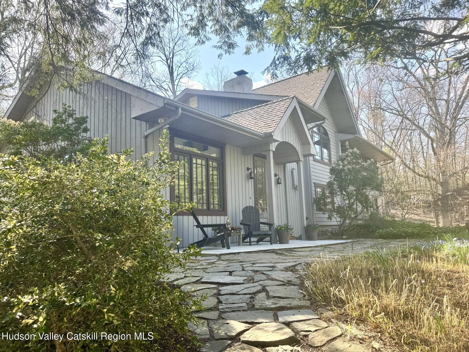 115 Jones Quarry Road Woodstock, NY 12498 - Photo 2 of 38 a front view of a house with garden